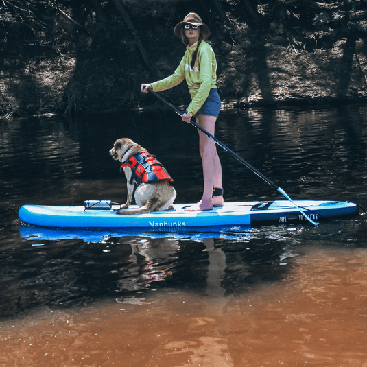 impi lite inflatable sup on river with labrador